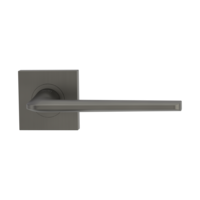 The image shows the Griffwerk door handle set REMOTE in the version with rose set square unlockable screw on cashmere grey