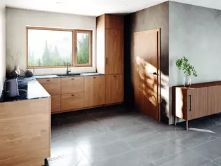A photo of a modern wooden kitchen with a matching door and window handle that form a harmonious unit