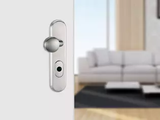 The illustration shows a security fitting on an apartment entrance door.