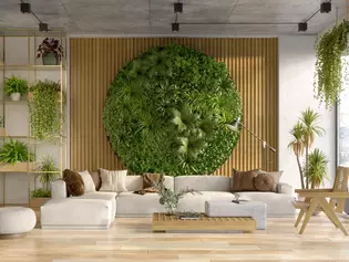 The picture shows a living room with wall greenery. 