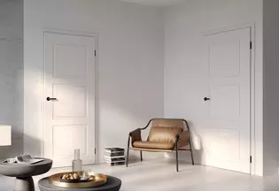 The picture shows a living room with two White doors and mounted Axum Door handle.