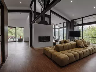 Salon moderne avec un mobilier élégant Salle de séjour confortable avec un aménagement de style - des couleurs harmonieuses, des meubles de qualité et une atmosphère accueillante pour une vie détendue.