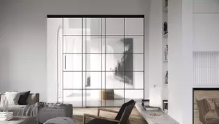 PLANEO LOFT en situación de salón Los herrajes para puertas correderas Planeo Air citan los típicos marcos de hierro del estilo loft, pero hablan un lenguaje mucho más minimalista y tranquilo.