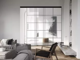 PLANEO LOFT en situación de salón Los herrajes para puertas correderas Planeo Air citan los típicos marcos de hierro del estilo loft, pero hablan un lenguaje mucho más minimalista y tranquilo.