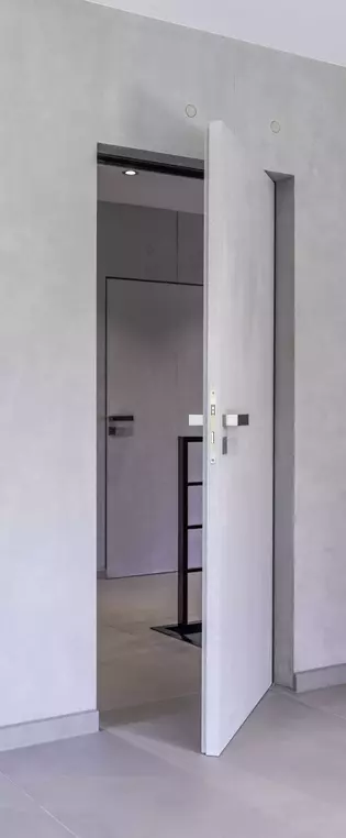 Illustration d'une porte qui s'ouvre La figure montre comment la porte Vitadoor Modulwerk 1.0. s'ouvre ou se ferme avec la poignée de porte FRAME.