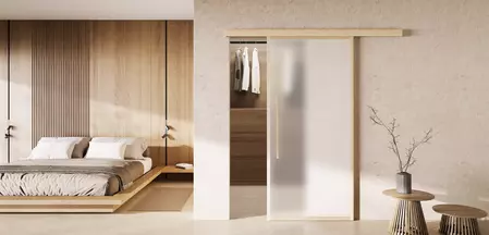 The picture shows a home picture with the mounted sliding door Planeo X in Wood.