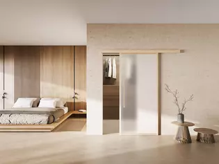 The picture shows a home picture with the mounted sliding door Planeo X in Wood.