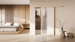 L'illustration montre un tableau d'habitation avec la porte coulissante Planeo X en bois montée.
