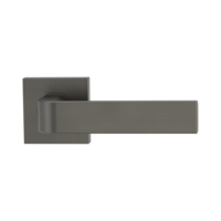 The image shows the Griffwerk door handle set GRAPH in the version with rose set square unlockable screw on cashmere grey