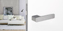 The image shows the Griffwerk door handle R8 One with a living room.