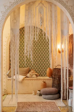 The illustration shows an apartment furnished in Moroccan style