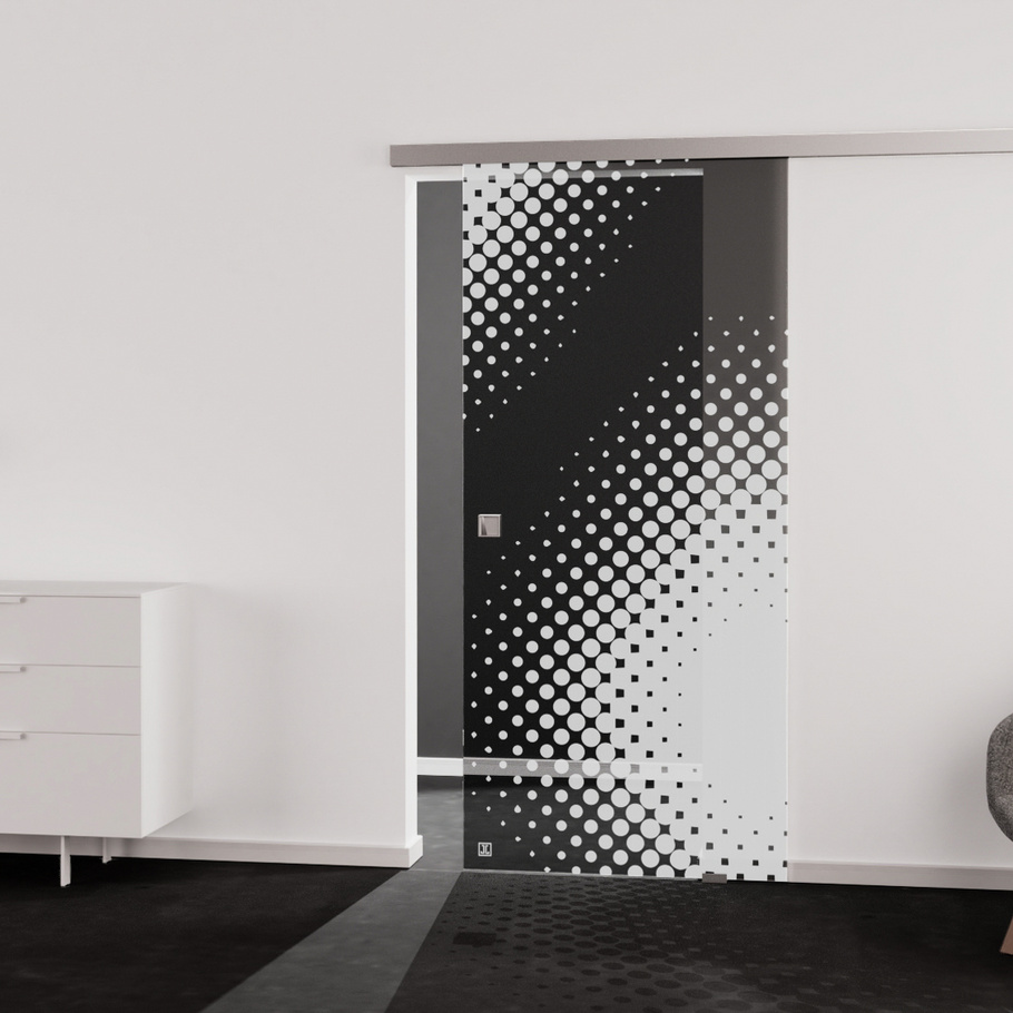 Living situation which shows the glass door with tempered safety glass (ESG) laserdecor JETTE DOTS 573 in the vision clear MOON GREY drilling Studio/Office sliding door