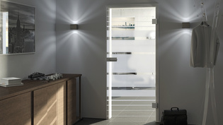 The illustration shows a light hallway with the glass door Lines Rising 509 by Griffwerk