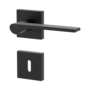 Isolated product image in the left-turned angle shows the GRIFFWERK rose set square LEAF LIGHT in the version mortice lock - graphite black - screw on technique