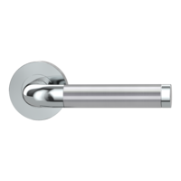 The image shows the Griffwerk door handle set SIMONA in the version with rose set round unlockable screw on chrome/brushed steel