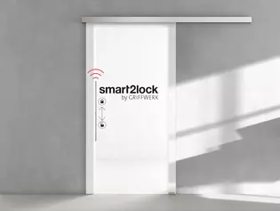 PLANEO smart2lock en el salón PLANEO smart2lock: No molestar con sólo pulsar un botón: privacidad para habitaciones con puertas correderas con un cómodo manejo con 1 mano.