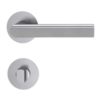 The image shows the Griffwerk door handle set TRI 134 in the version with rose set round wc flat rose brushed steel