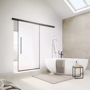 The picture shows the Planeo Air sliding door by Griffwerk in a modern bathroom.