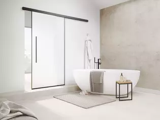 The picture shows the Planeo Air sliding door by Griffwerk in a modern bathroom.