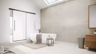L'illustration montre la porte coulissante Planeo AIR de Griffwerk dans une salle de bains moderne.