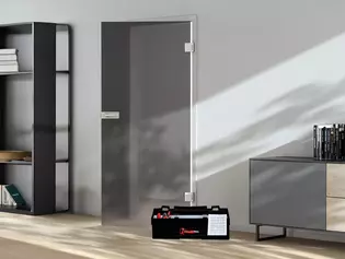 The illustration shows a glass door and a toolbox standing in front of it.