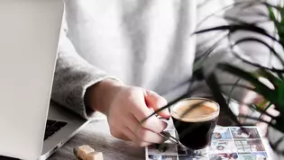 The illustration shows a woman at a desk with a coffee cup.