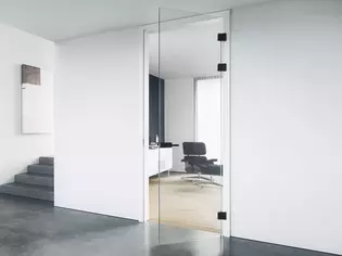 The picture shows a hallway with glass doors.