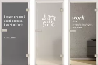 The picture shows three glass doors with different lasered texts.