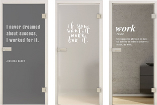 The picture shows three glass doors with different lasered texts.