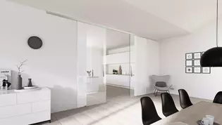Die Abbildung zeigt die Griffwerk Glasschiebetür Planeo in einem Wohnraum.