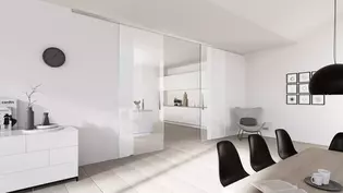 Die Abbildung zeigt die Griffwerk Glasschiebetür Planeo in einem Wohnraum.
